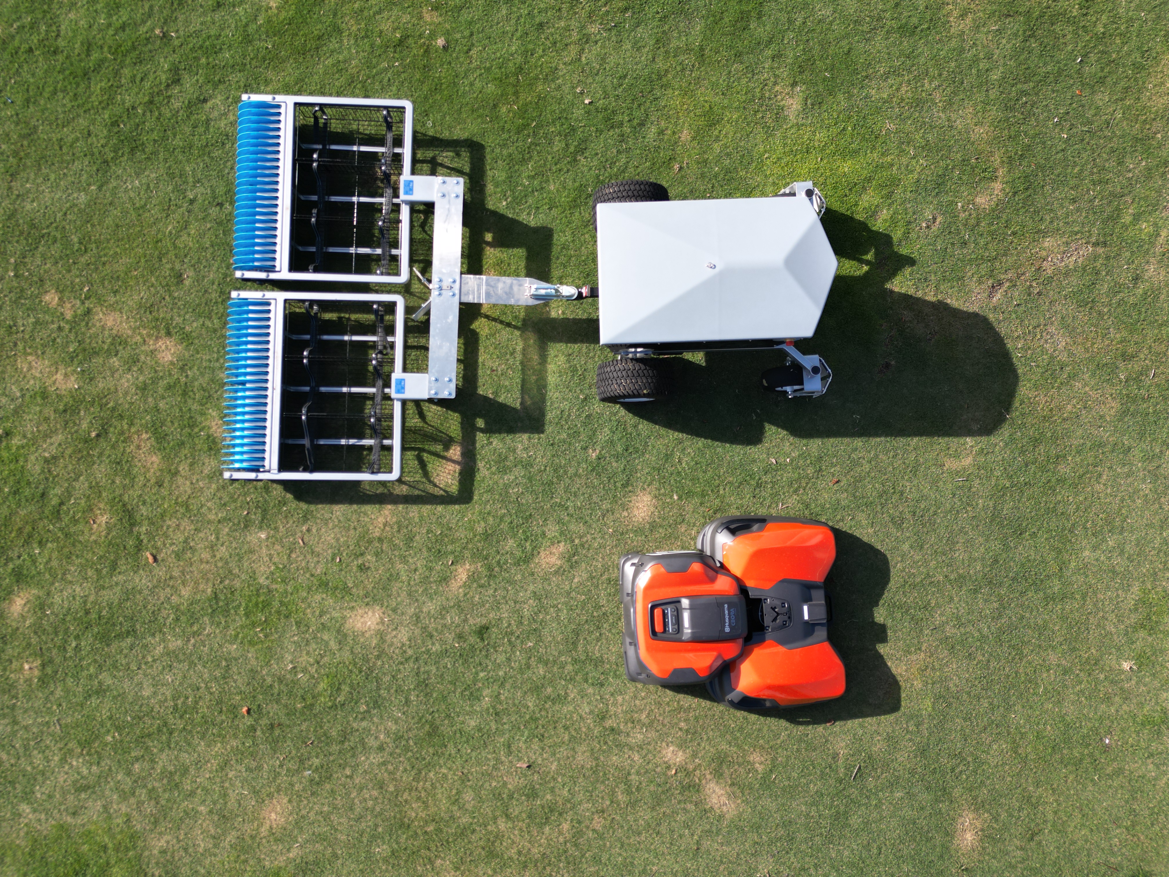 Aerial view of range picker robot in operation on golf course